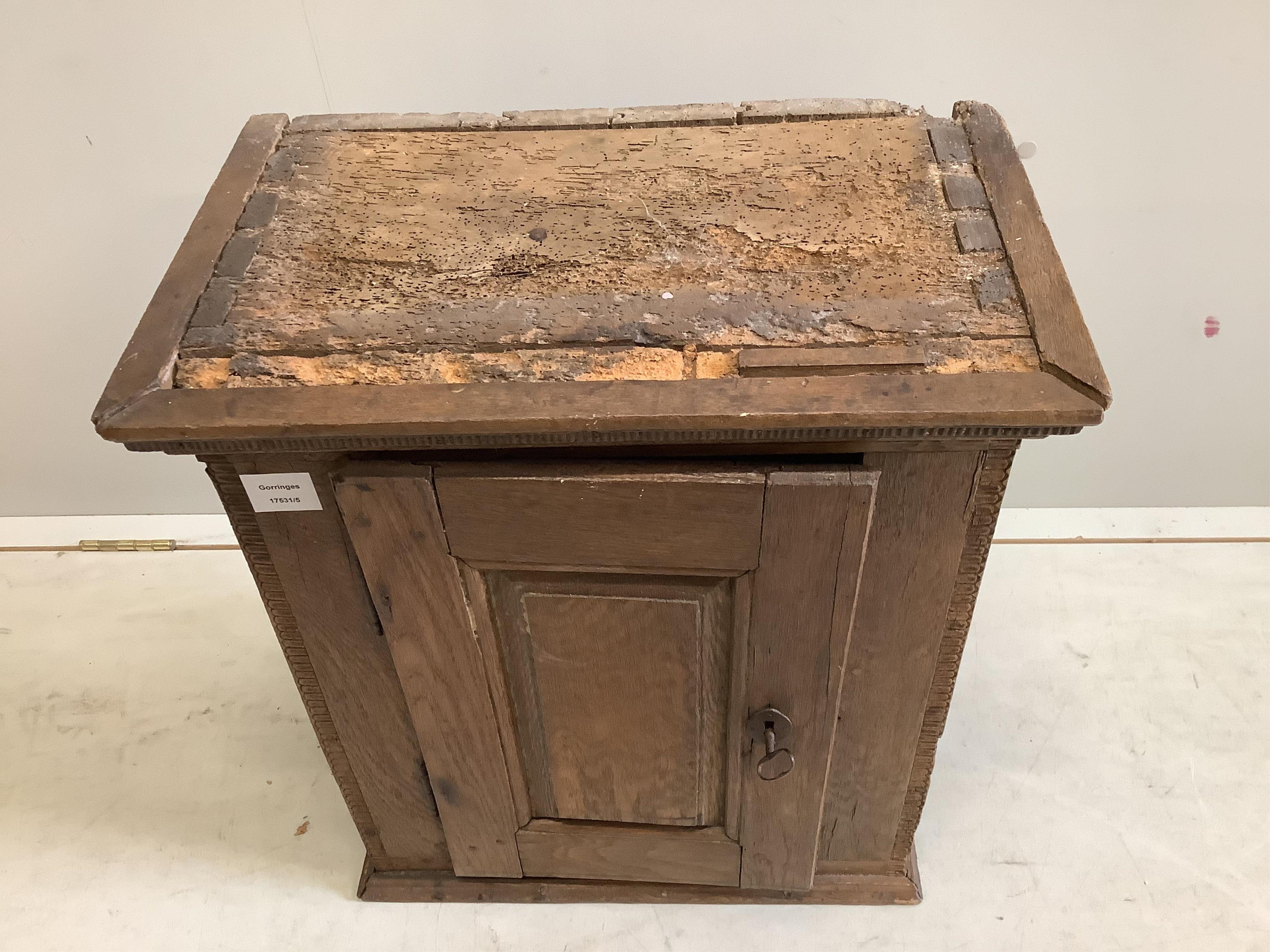 A small oak cupboard, width 51cm, depth 31cm, height 59cm
